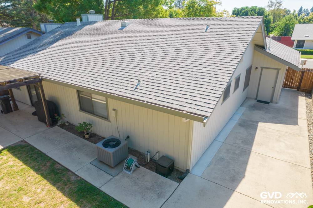 Modern home exterior featuring James Hardie Siding, gray roof, and landscaped yard in Sacramento