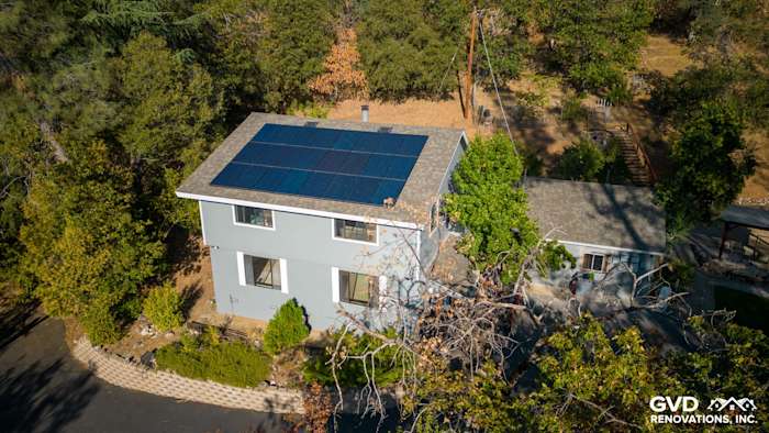 Gray Slate James Hardie siding and Arctic White trim on a renovated Colfax home with solar panels