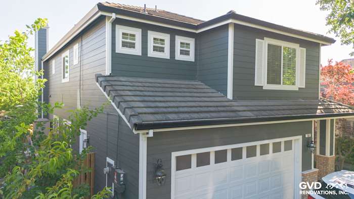 Home exterior featuring James Hardie Iron Gray siding, Arctic White trim, and new Anlin windows in Petaluma, CA