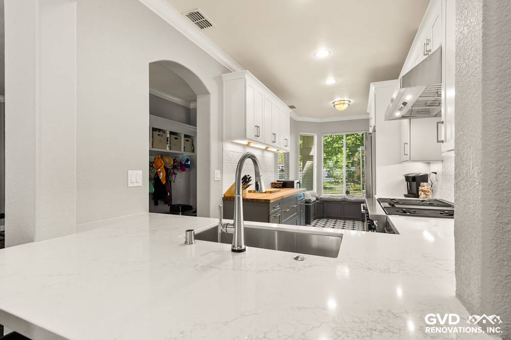 Modern kitchen remodel in Folsom featuring quartz countertops, stainless steel appliances, and bright natural light