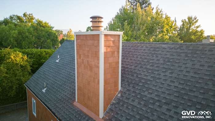 FTX Cedar Sidewall Panel Siding on a chimney, featuring a modern cap atop a shingled roof in Sonoma, CA