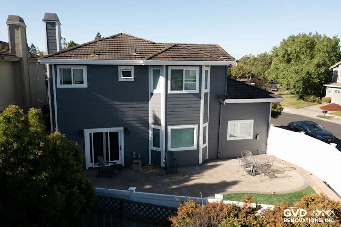 Modern home exterior in Petaluma featuring Night Gray James Hardie lap siding and new vinyl windows