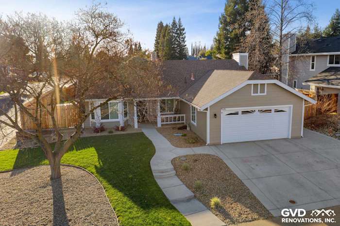 Exterior of a home in Folsom, CA with Monterey Taupe HardiePlank siding and Arctic White trim. Enhanced curb appeal