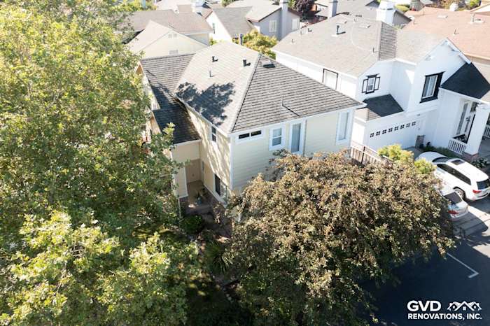 Home exterior featuring Prodigy insulated vinyl siding in light yellow, surrounded by trees in Petaluma, CA