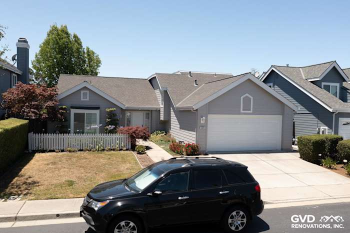 Home exterior featuring James Hardie Plank Lap Siding in Pearl Gray with white trim and manicured landscaping