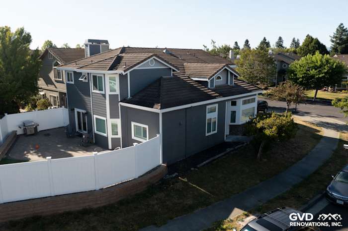 Home exterior with James Hardie Night Gray lap siding, Pearl Gray shingles, and Arctic White trim in Petaluma