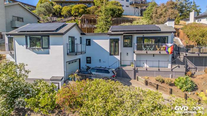 Modern home exterior in San Rafael featuring Arctic White James Hardie siding and Anlin Catalina windows