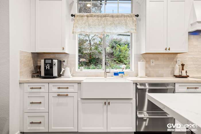 Bright kitchen featuring Waypoint cabinets, farmhouse sink, and Custom Vadara Bronzo countertops in Folsom, CA