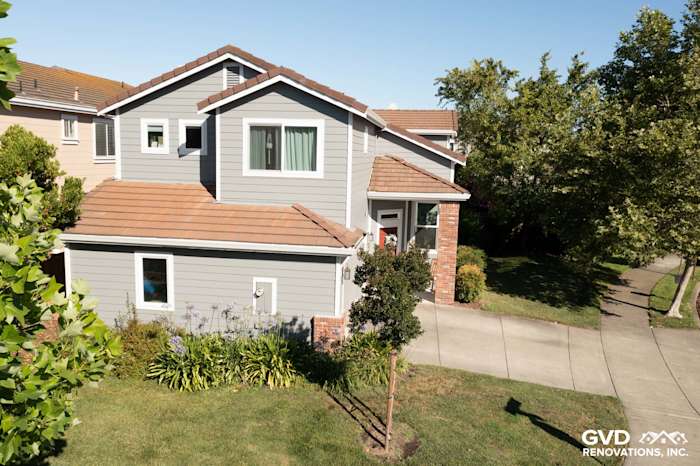 Home exterior featuring Gray Slate James Hardie siding and Milgard vinyl windows with Arctic White trim in Petaluma