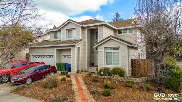 Updated home exterior featuring James Hardie Cobble Stone Lap Siding and Arctic White Trim in Petaluma