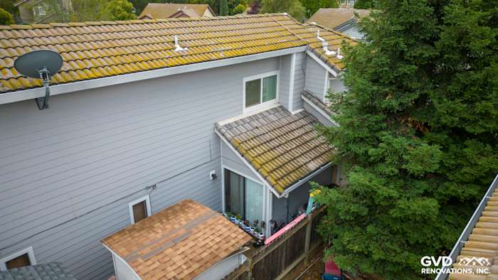 James Hardie siding in Pearl Gray with Arctic White trim on a Rocklin home exterior, showcasing a renovated roofline