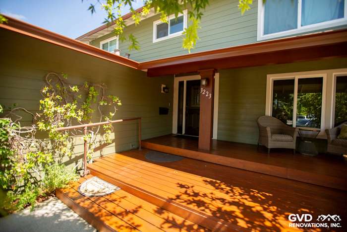 New James Hardie siding in green and upgraded wood deck on a Pleasanton home entryway