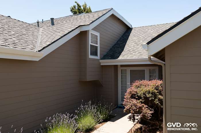 Khaki brown James Hardie Artisan Lap Siding with Arctic White trim on a Foster City home exterior