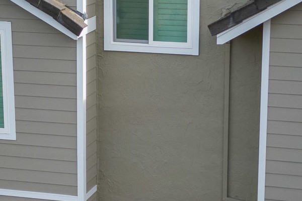 Danville home with James Hardie Monterey Taupe siding and Arctic White trim, featuring a spacious deck