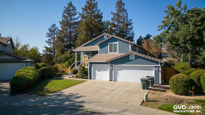 Updated home exterior in Dixon, featuring new siding, Anlin windows, and a refreshed deck with side steps