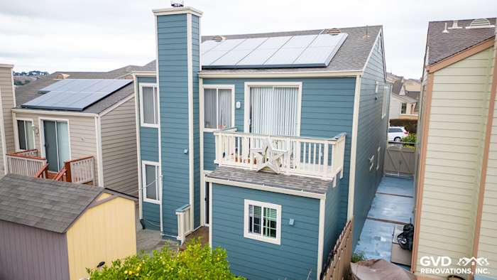 Evening Blue James Hardie lap siding on a modern home in Daly City with solar panels