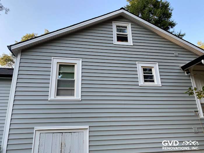 Light gray Prodigy Vinyl Siding on two-story home in Grass Valley, showcasing new windows and trim