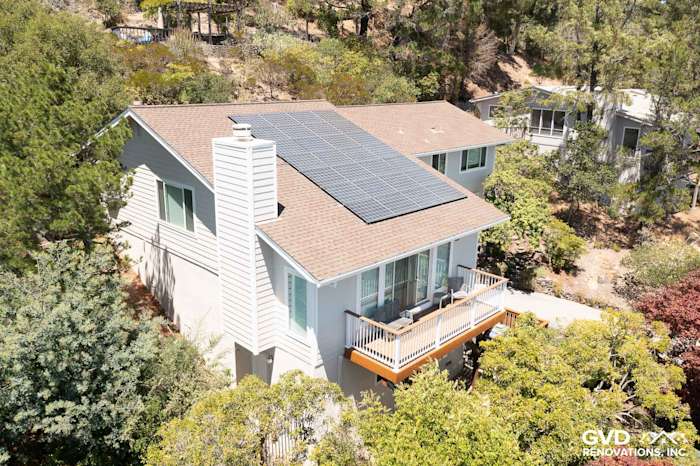 Home exterior showcasing James Hardie siding in Cobble Stone and Andersen windows with solar panels in San Rafael