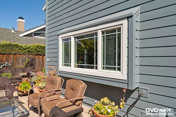 Boothbay Blue HardiePlank siding and Milgard windows with Arctic White trim in Foster City backyard
