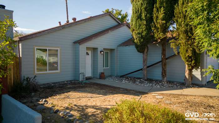 Newly installed James Hardie HardiePlank siding in light blue on Sacramento home exterior, featuring trimmed windows