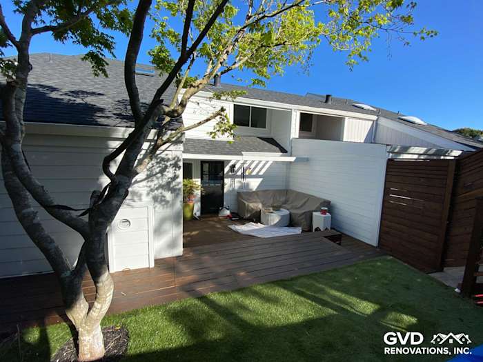 Newly installed James Hardie lap siding and an updated deck with wood railings in Mill Valley backyard