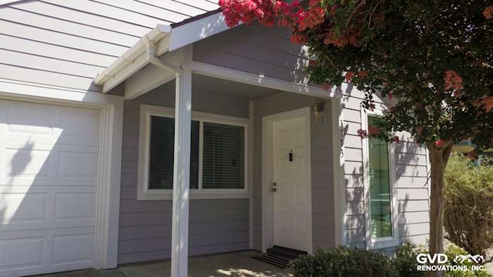 Pearl Gray HardiePlank lap siding with Arctic White trim on a home exterior entryway in Davis, CA