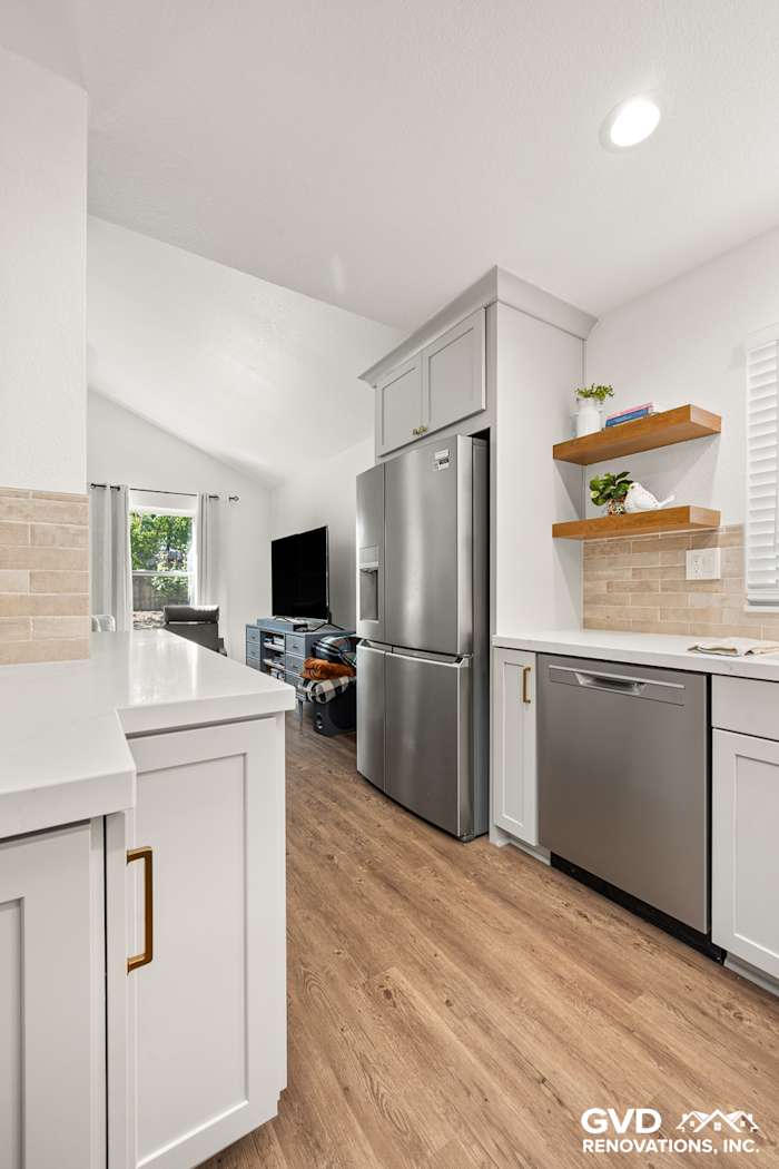 Modern kitchen remodel in Roseville with Waypoint cabinetry, Vadara countertops, and MSI Brickstone Ivory backsplash