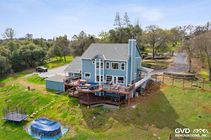 Newly installed James Hardie siding on a modern two-story home with a large deck in Shingle Springs, CA