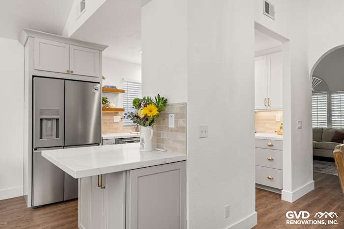 Modern kitchen remodel in Roseville featuring Waypoint cabinetry, Naurelle stone countertops, and decorative backsplash tiles