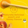 Peaches and honey strewn across a yellow background with the text 'naturally delicious peach and honey flavour'