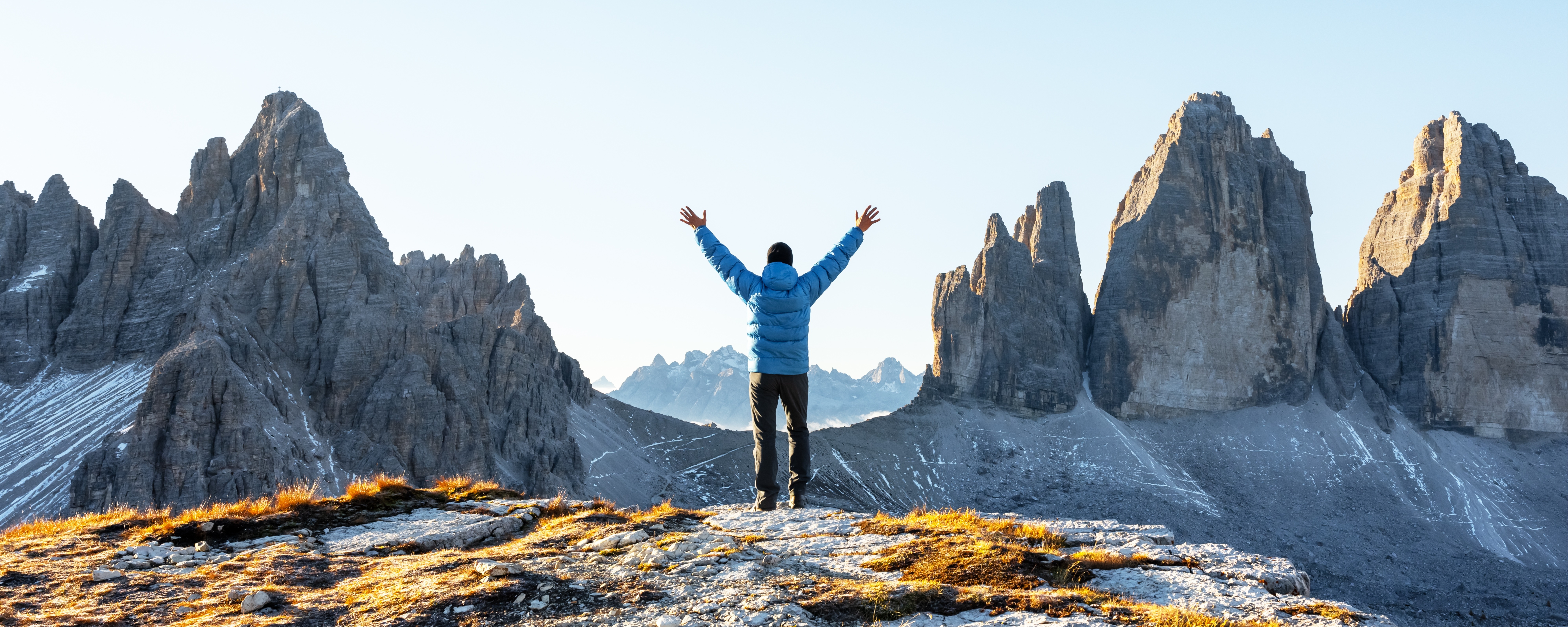 Enjoying the view in front of the Tre Cime di Lavaredo, Dolomites, Italy. Photo Smit, Shutterstock