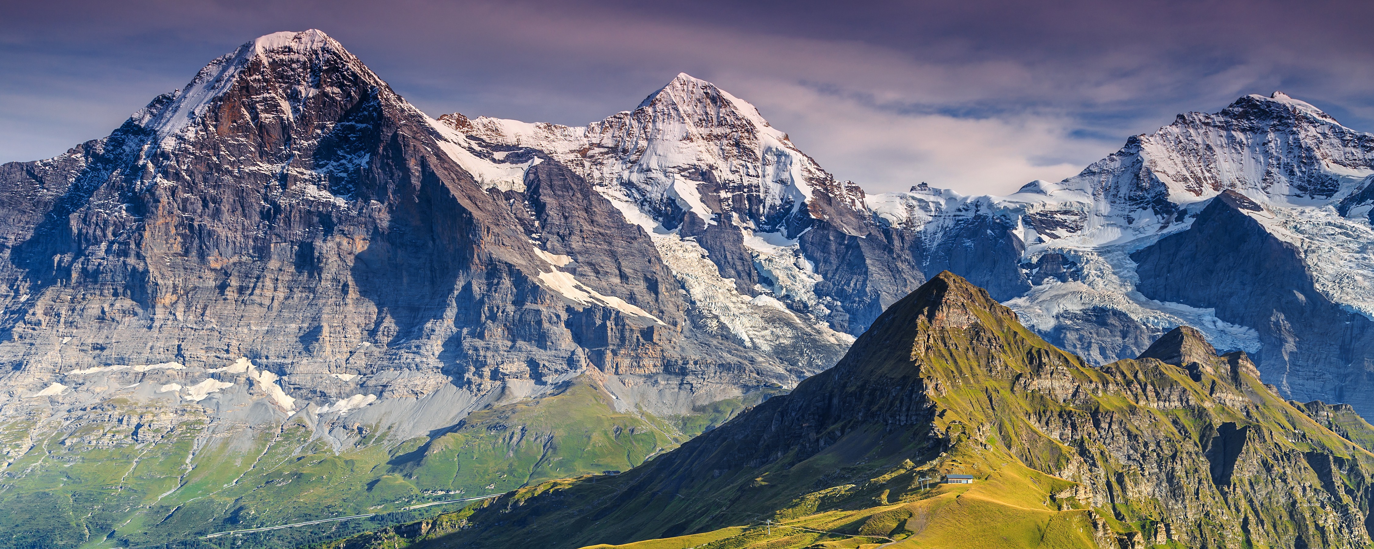 The most famous almost-4000er of all (the Eiger) on the left with the Mönch and Jungfaru (4000ers both) centre and right. Photo Gaspar Janor, Shutterstock.