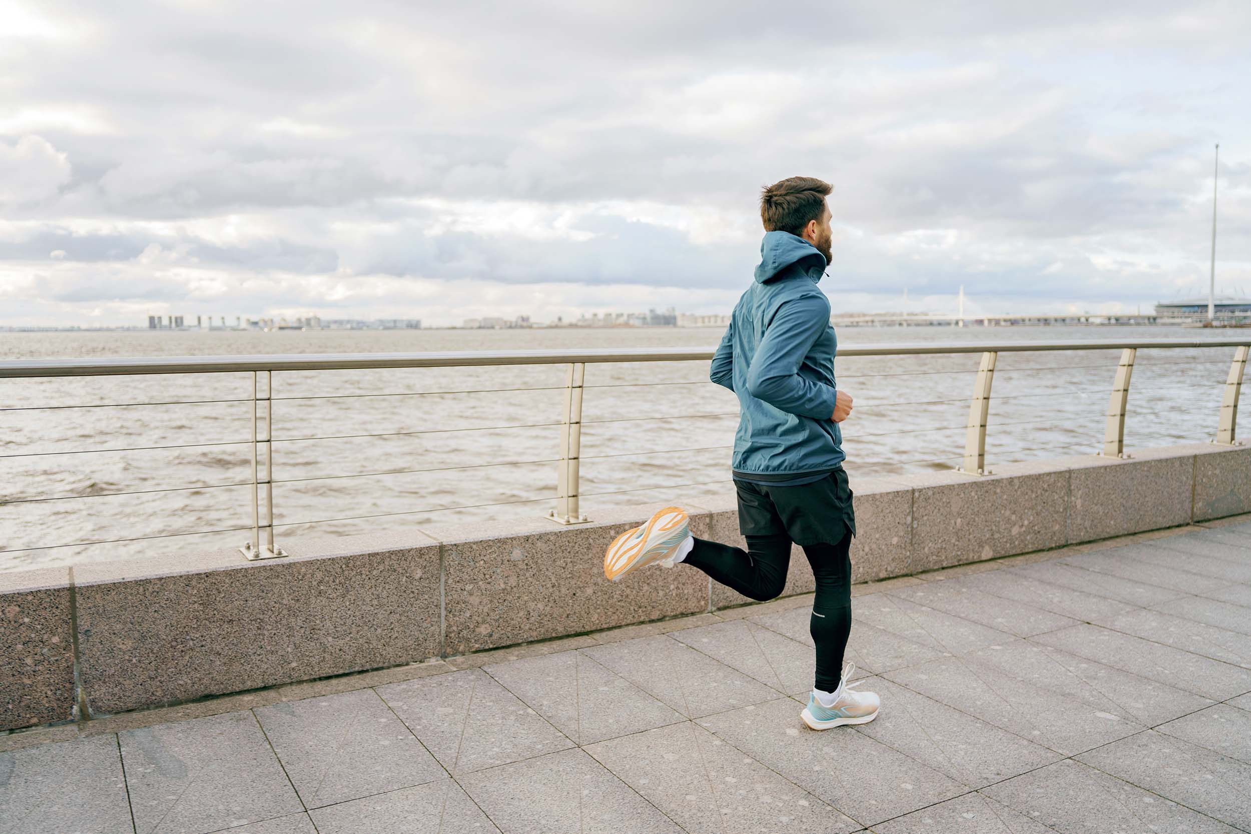 Runner on a coastal path. Photography by muse studio