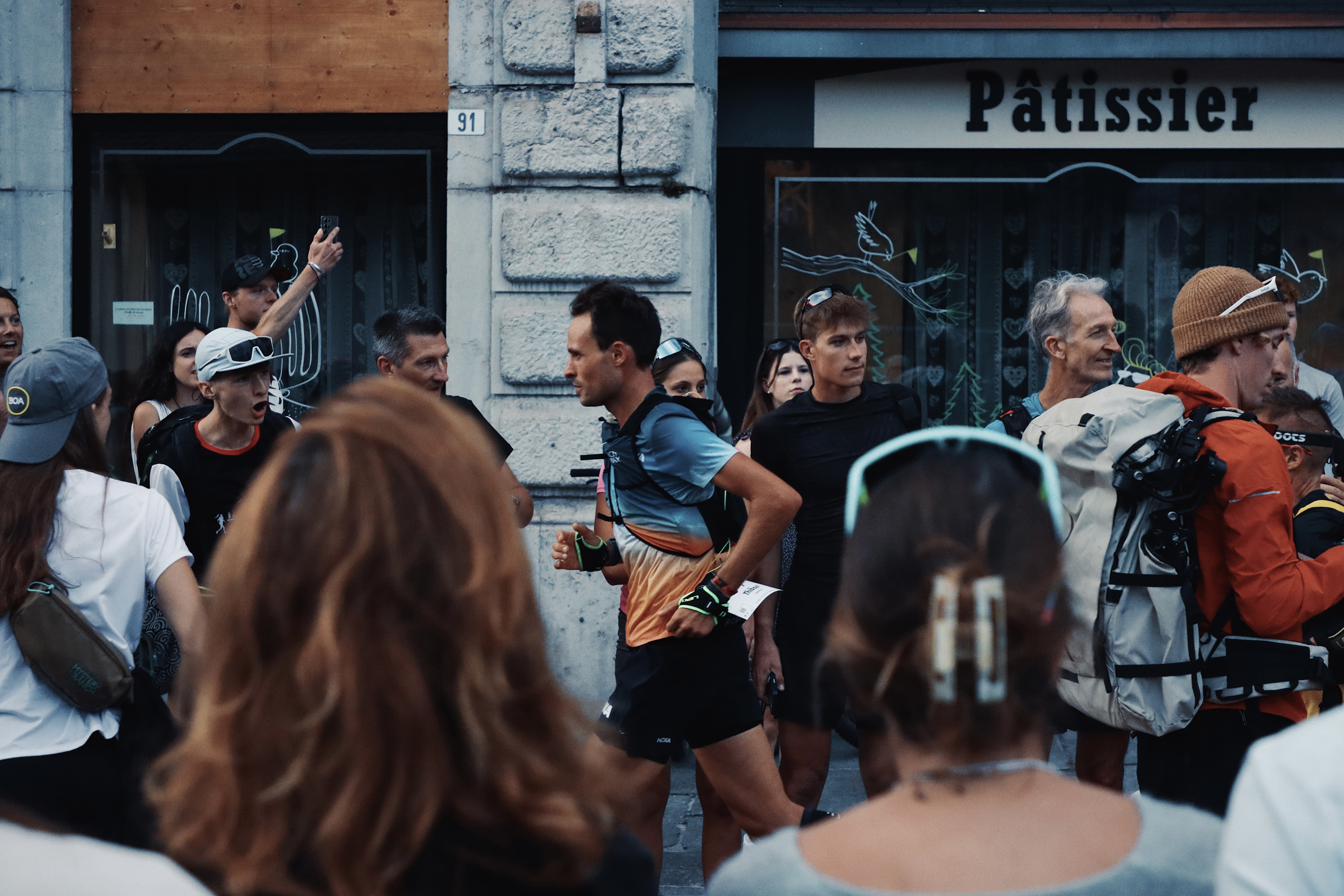 Thibaut Garrivier running through the lively streets of Saint Gervais. Photograph: Richard Miller