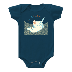 Boy riding a narwhal print on a onesie