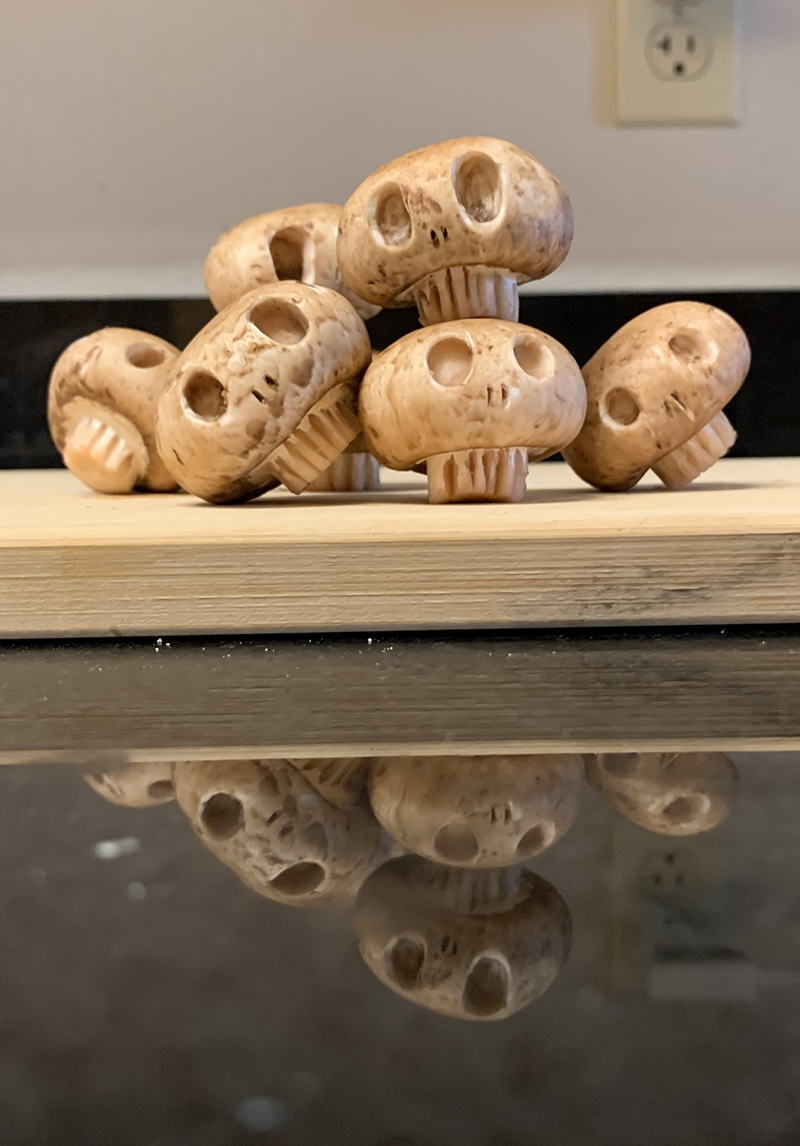 A pile of mushrooms carved into skulls.