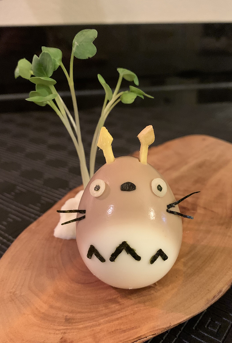 Totoro, made of a soft-boiled egg partially marinated in a soy sauce/mirin mixture, ginger, and nori.