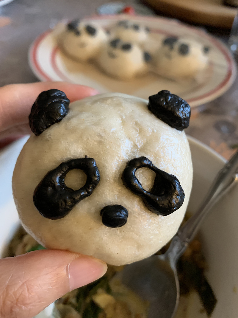 Panda steamed baos, made with dough that has been mixed with black squid ink.