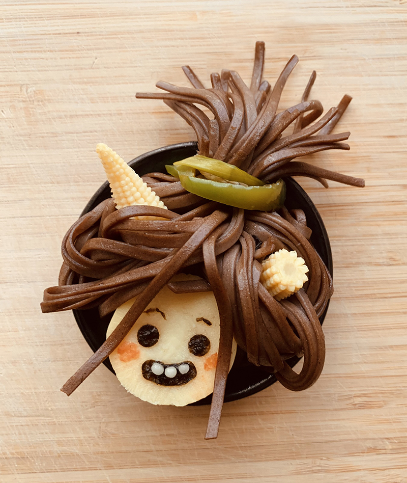 Onari, made of bamboo shoots, soba noodles, baby corn, green bell pepper, almond paste, and nori. 