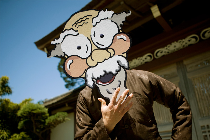 Cardboard older man in front of a Japanese temple