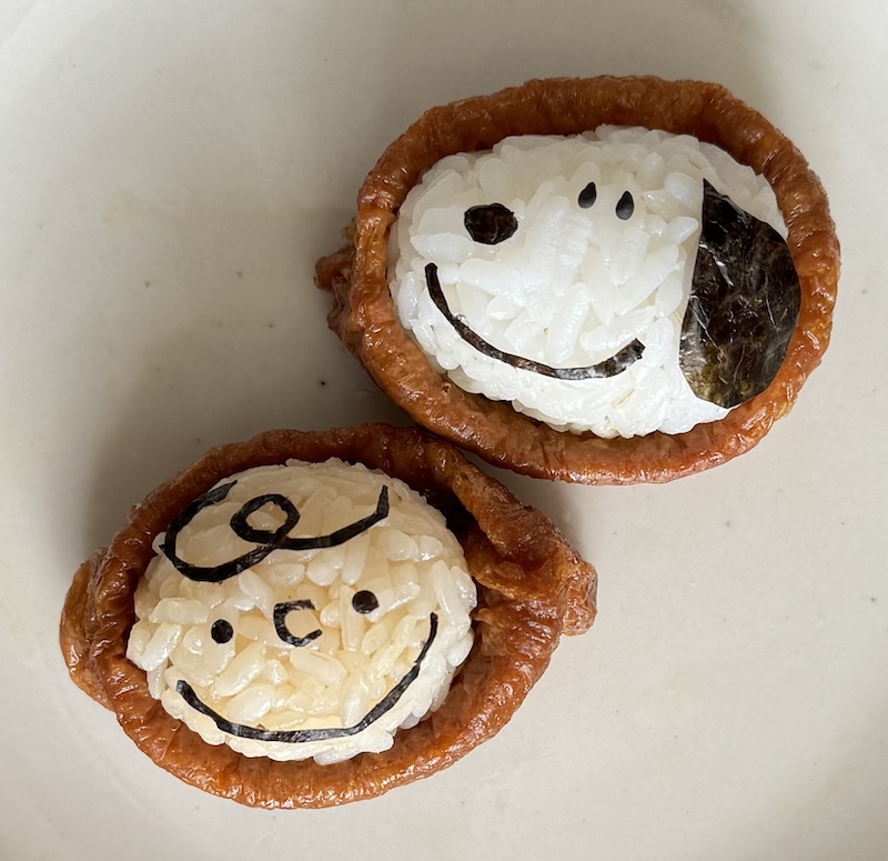 Charlie Brown and Snoopy, made with rice, tofu wrappers, and nori.