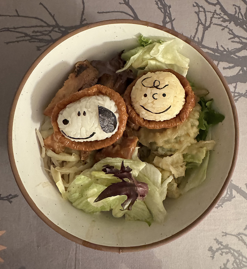 Charlie Brown and Snoopy, made with rice, tofu wrappers, and nori.