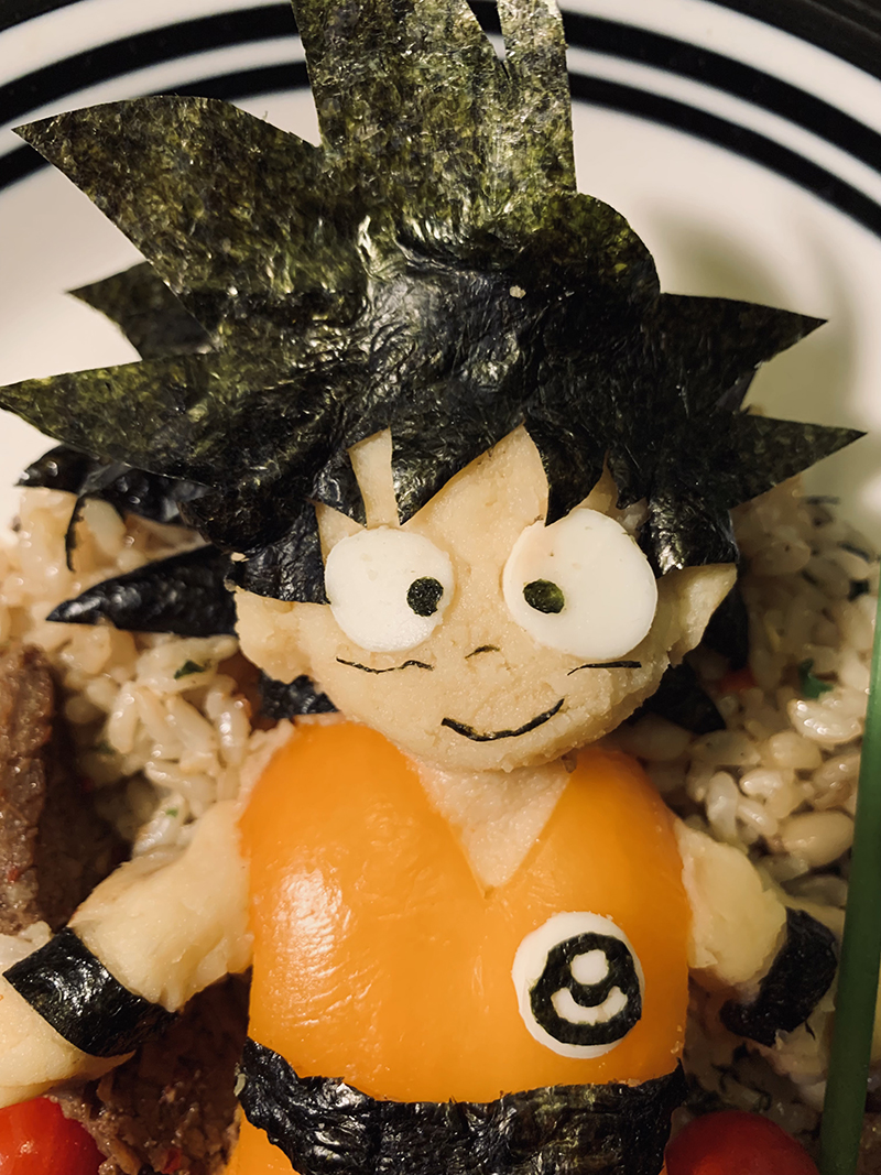 Goku, made of mashed potatoes, orange bell pepper, tofu, and nori.