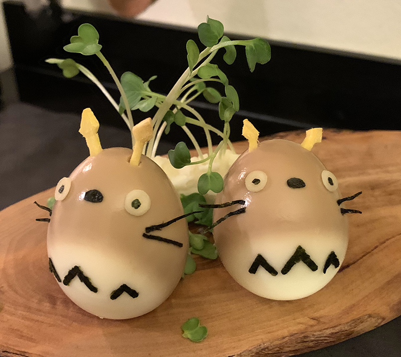 Totoros, made of soft-boiled eggs partially marinated in a soy sauce/mirin mixture, ginger, and nori.