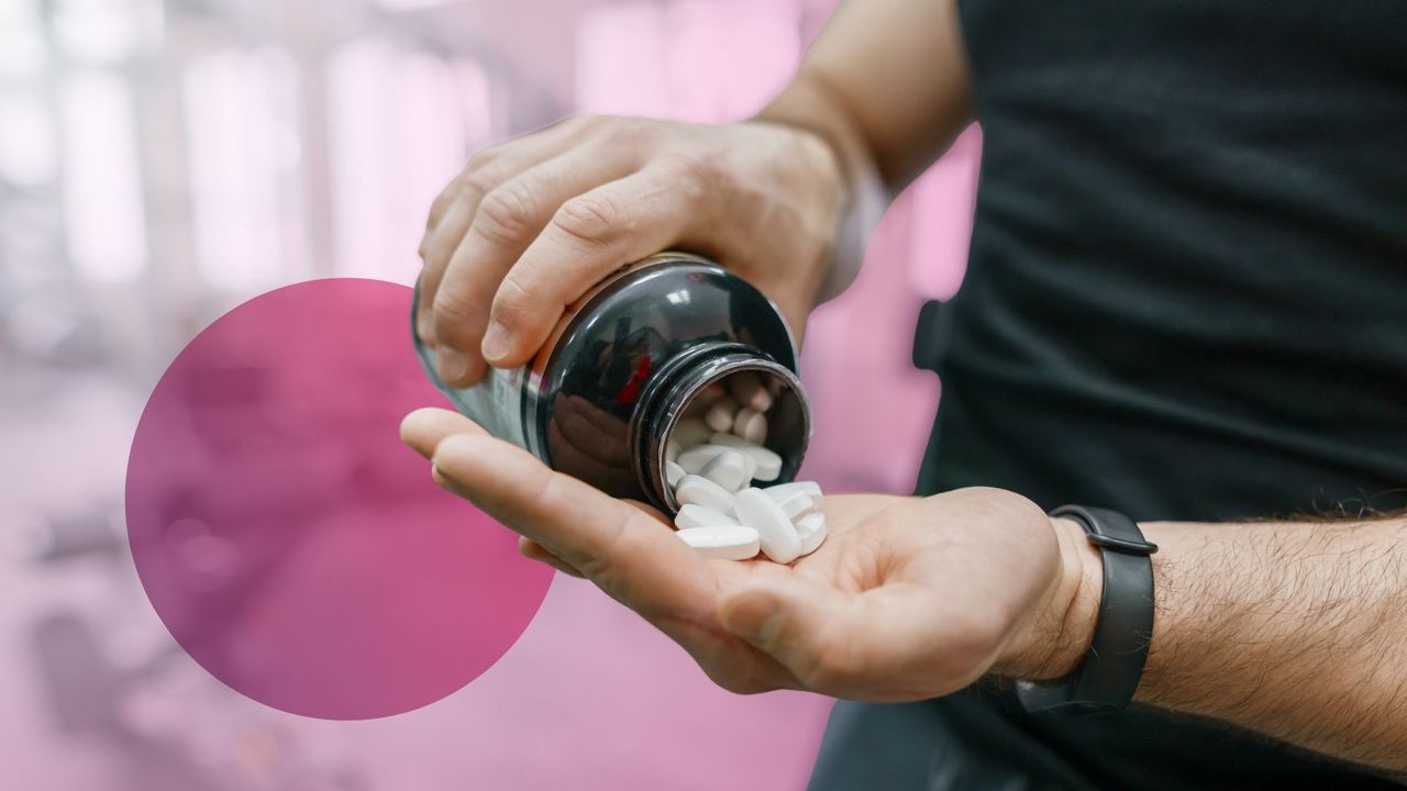 Gym enthusiast holding supplement capsules, highlighting popular fitness supplements like protein and amino acids