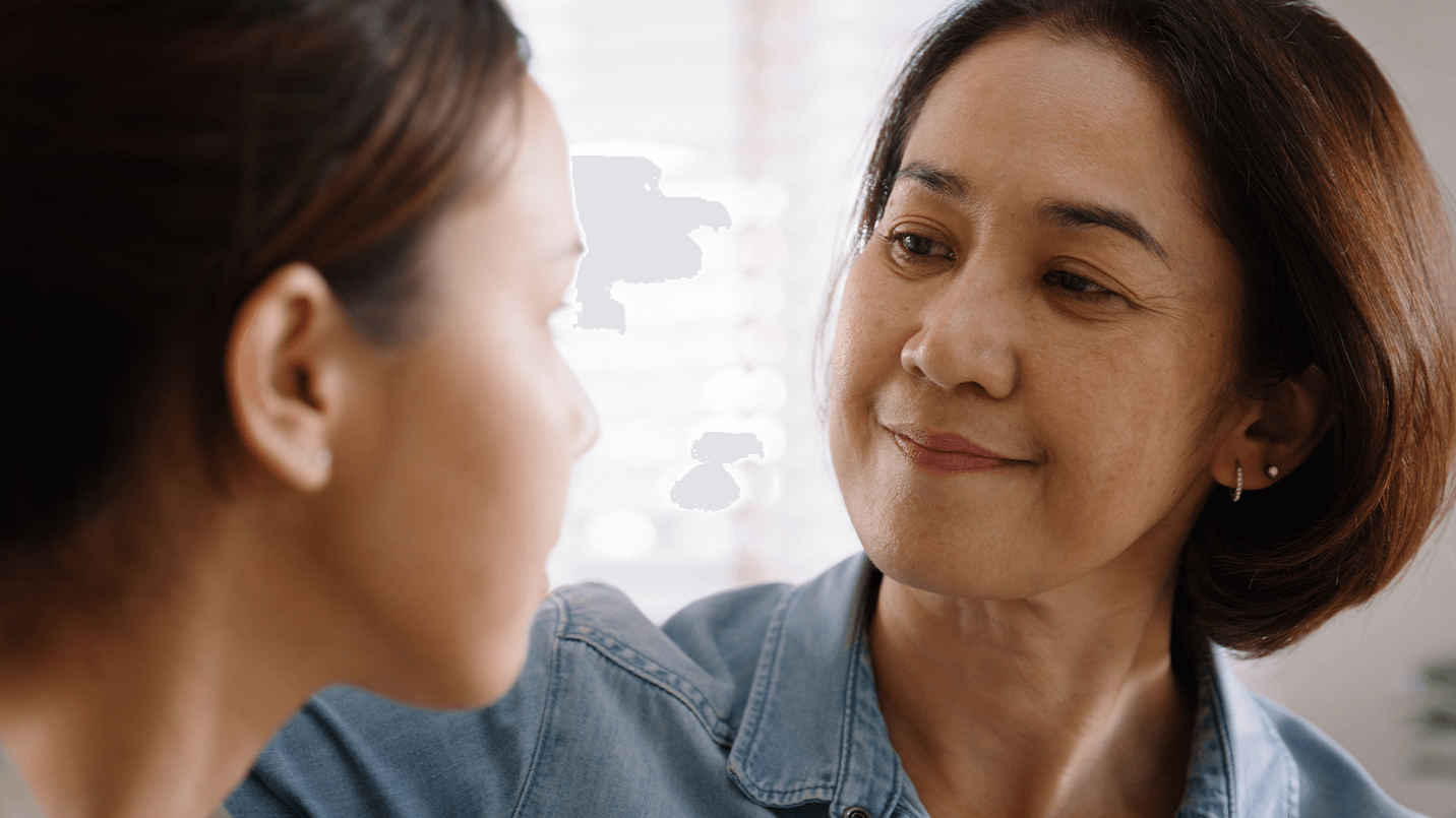 Older women looking at a young girl 