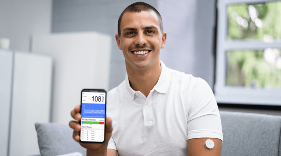 diabetic-man-smiling-wearing-continuos-glucose-monitor