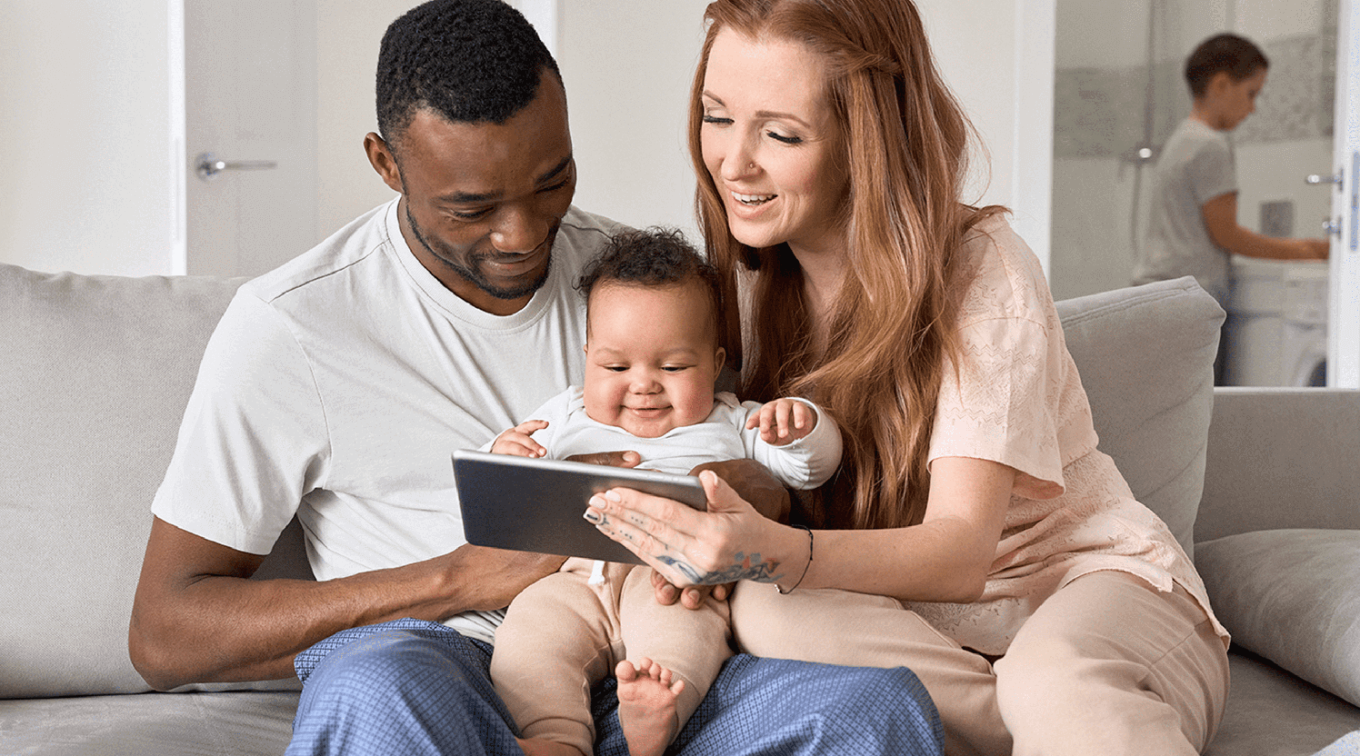 Mother-father-and-infant-communicating-with-provider-via-telehealth