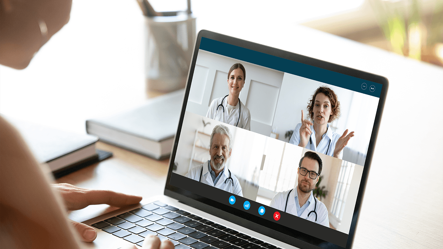 Female patient on a video conferencing call with her team of providers