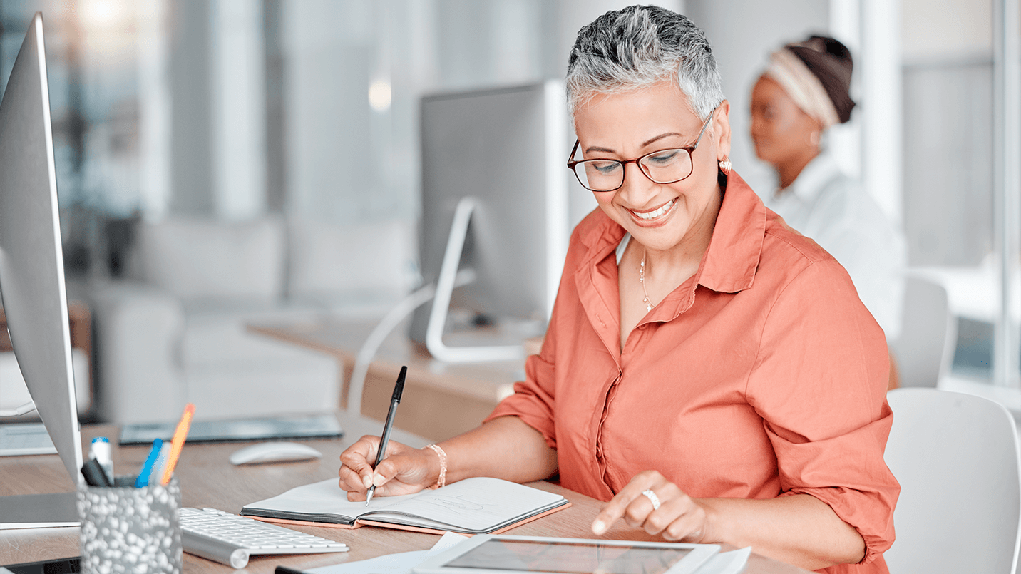Middle aged woman charting and submitting insurance claims